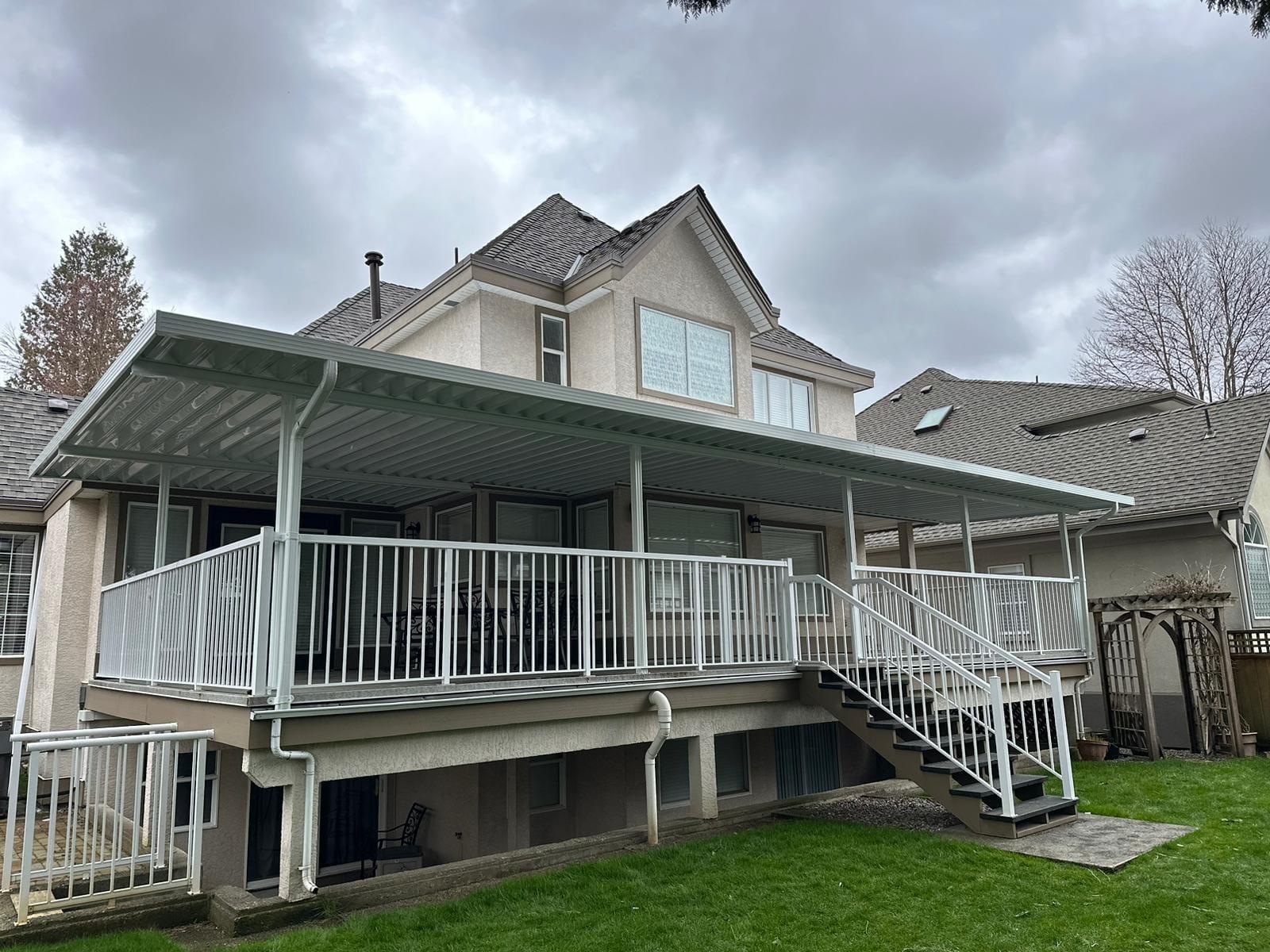 Aluminum carport shade structure with solid roof panels